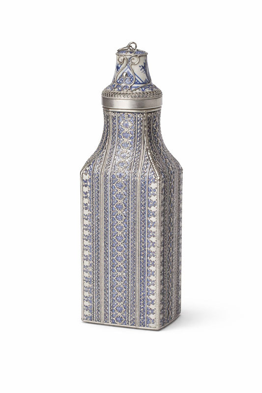 Decorative pottery bottle filled with handmade wire